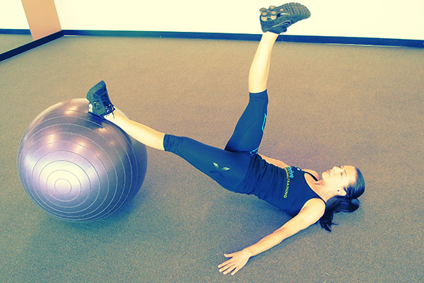 Swiss Ball Straight Leg Bridge With Leg Lifts
